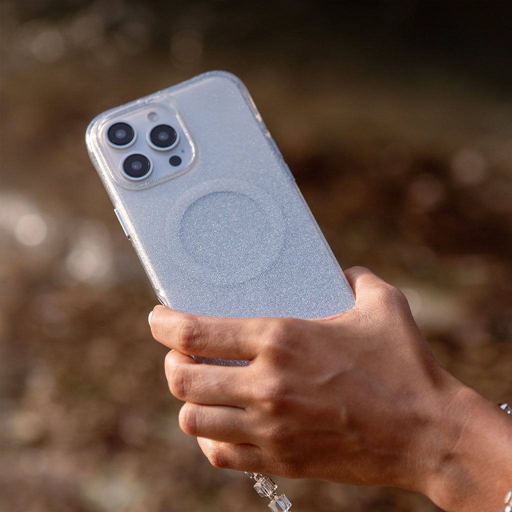 A lifestyle image of the LUMINO— the iPhone 16 Pro case, available in sparkling silver color