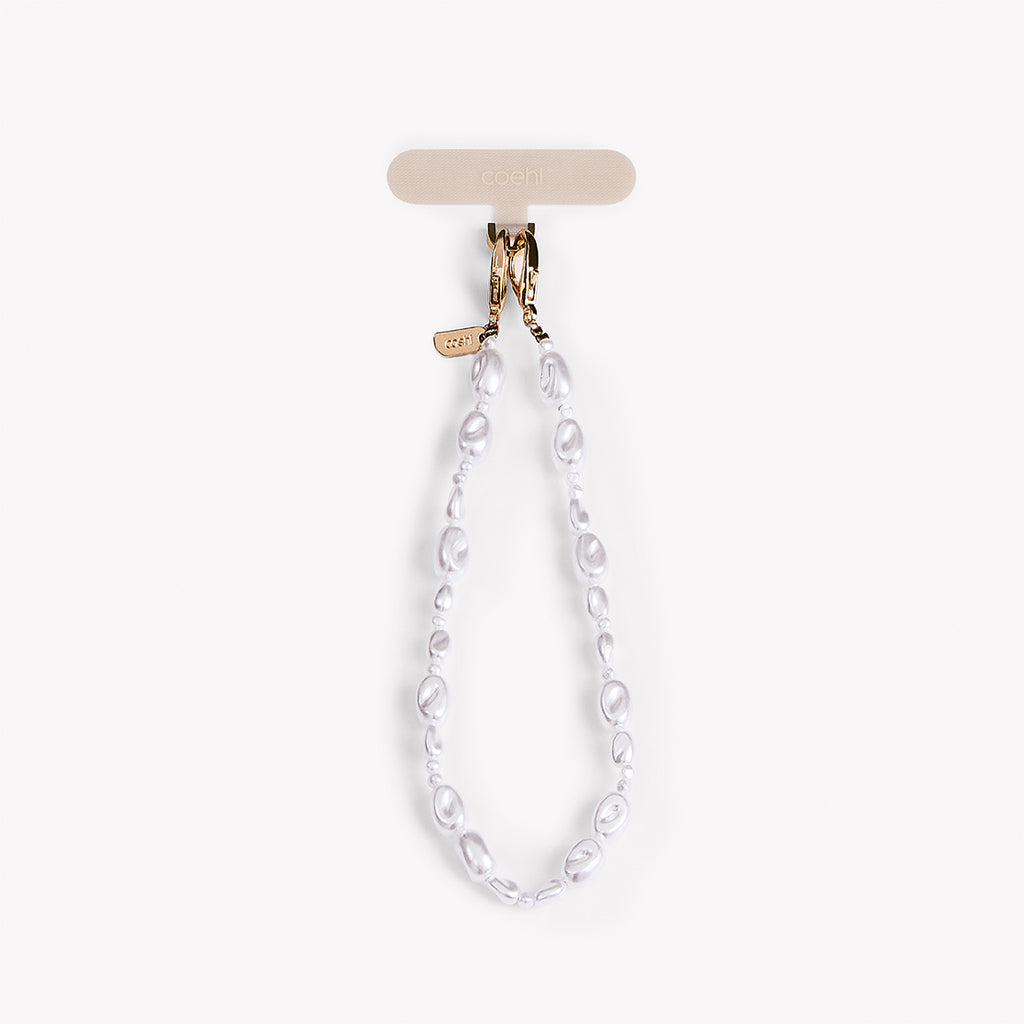 Perla Peal white phone charm. Designed for both elegance and durability, it’s the perfect accessory for today’s fashion-forward individuals.