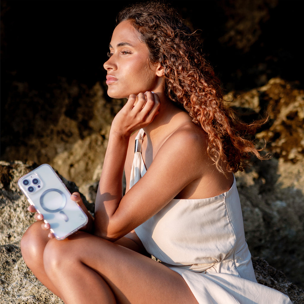 A model with SAVON, the iPhone 16 Pro phone case available in bubble prism color